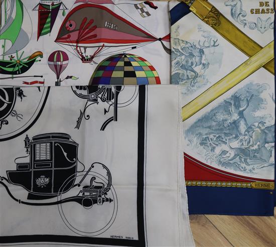 Three Hermes silk scarves,Armes de Chasse, Les Folies du Ciel and Carriages,